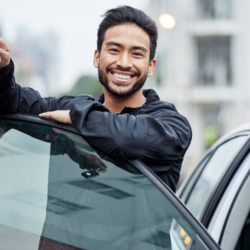 New car, city and portrait of man with keys after vehicle purchase to drive, transport and travel on street. Transportation, loan approval and happy person with freedom for trip, journey or adventure